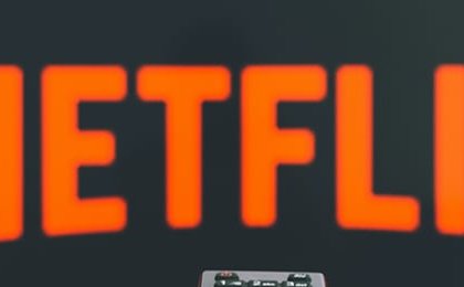 Netflix is in millions of homes, but the stock has nearly halved. Why Wall Street stopped paying up