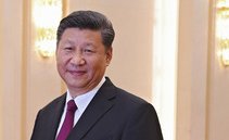 China's Xi soothes tones with US at top business meeting