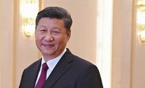 China's Xi soothes tones with US at top business meeting