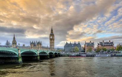 Bank of England cuts interest rates, sending sterling down