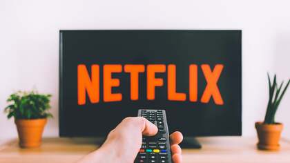 Netflix is in millions of homes, but the stock has nearly halved. Why Wall Street stopped paying up
